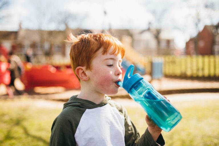 boy-drinking-water-in-park-optimised
